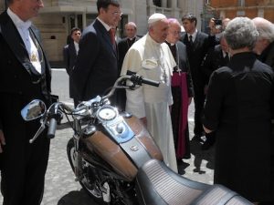 Pope Francis with the Harley Dyna expensive motorcycle