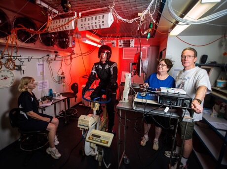 Testing motorcycle in the thermal chamber (from left) research assistant Liz Taylor, volunteer rider Dr Greg Peoples, Liz de Rome and Nigel Taylor. rating award