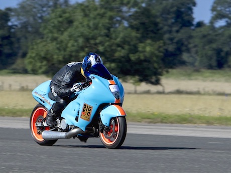 One armed high speed motorcycle rider Andy Slade who reached nearly 175mph (photo Andy Menzies) wheelie