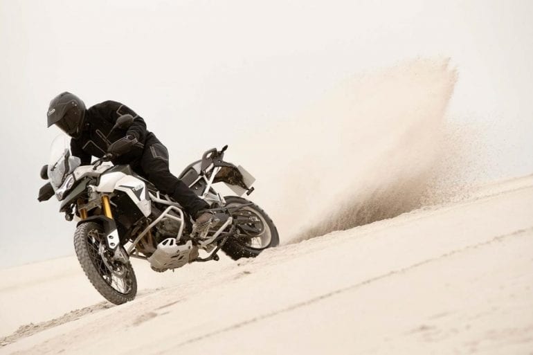 Hero image - Triumph Tiger 900 Rally Pro Riding In The Sand