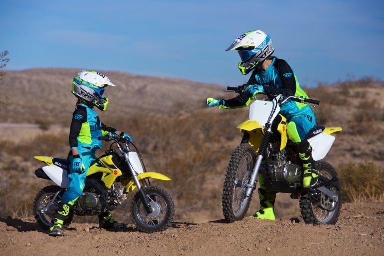 a mother and daughter team have fun with their off-road motorcycles