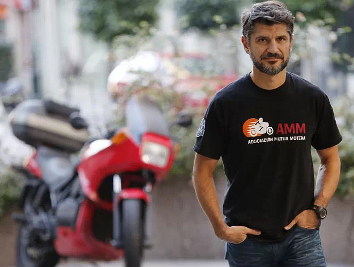 Juan Manuel Reyes, AMM President, in front of a motorcycle