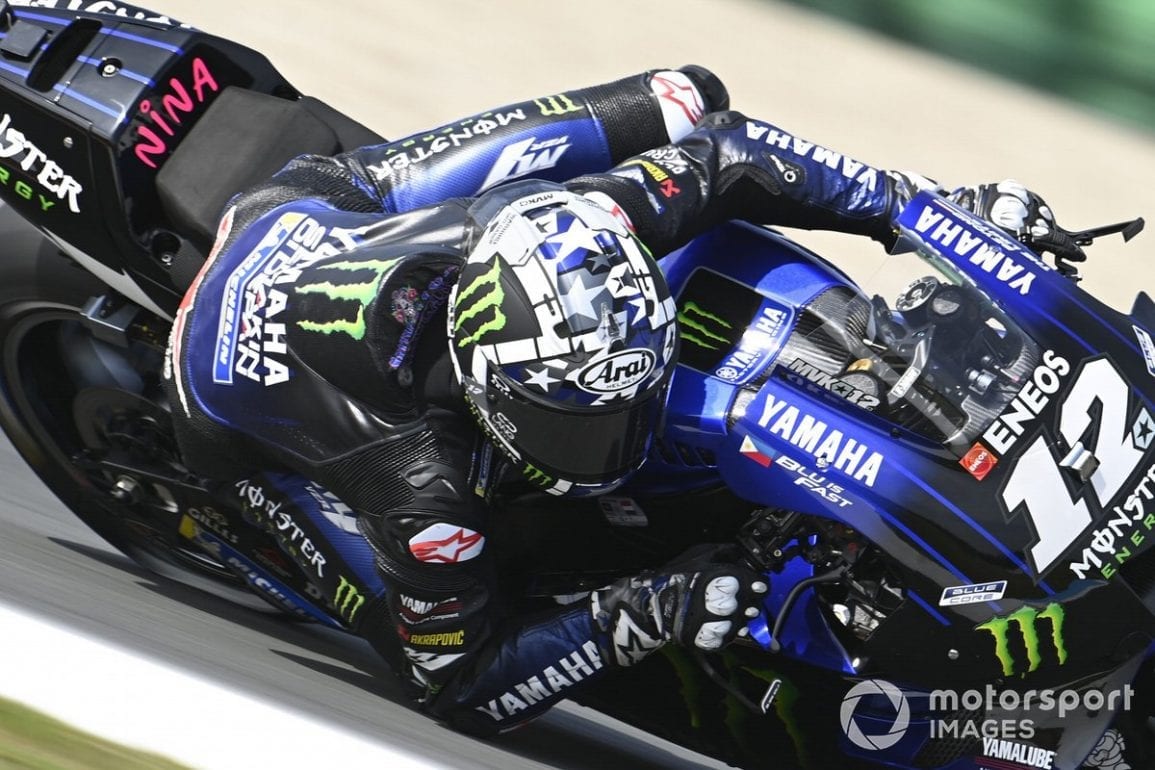 Maverick Vinales leaning into a turn in a race