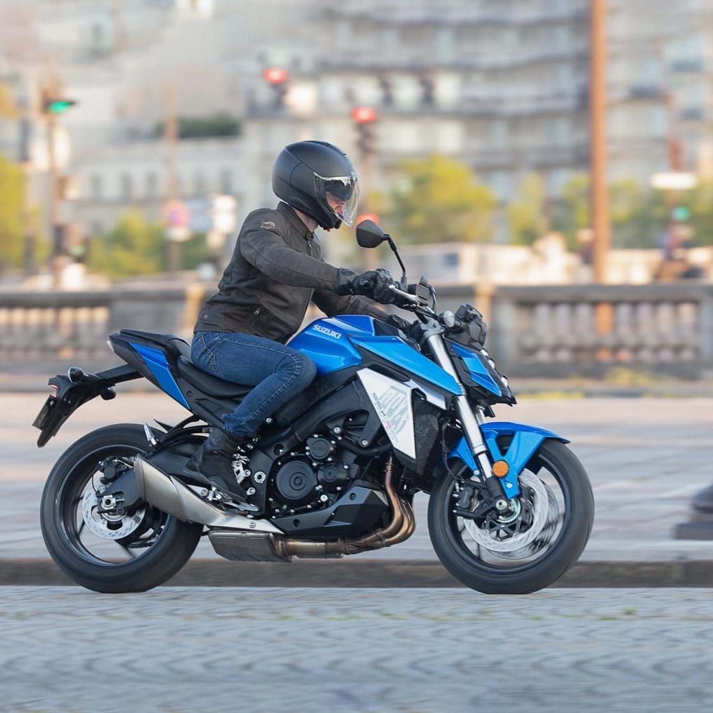 a photo of a rider trying out the new GSX-s950, in Triton Blue.