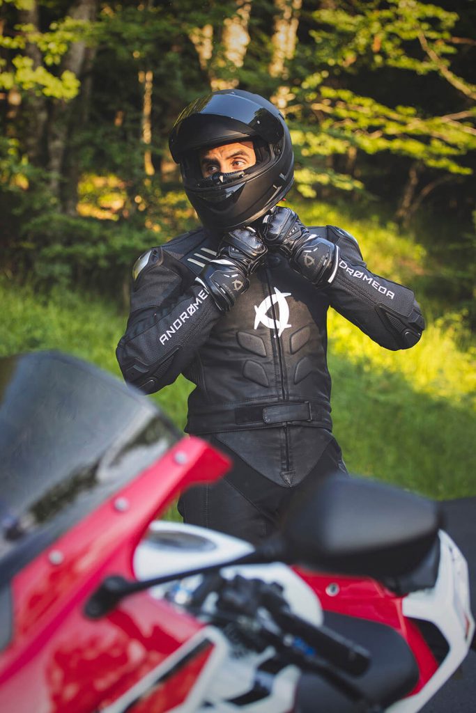 a man trying on the all-=new, vegan, environmentally friendly Andromeda NearX motorcycle suit