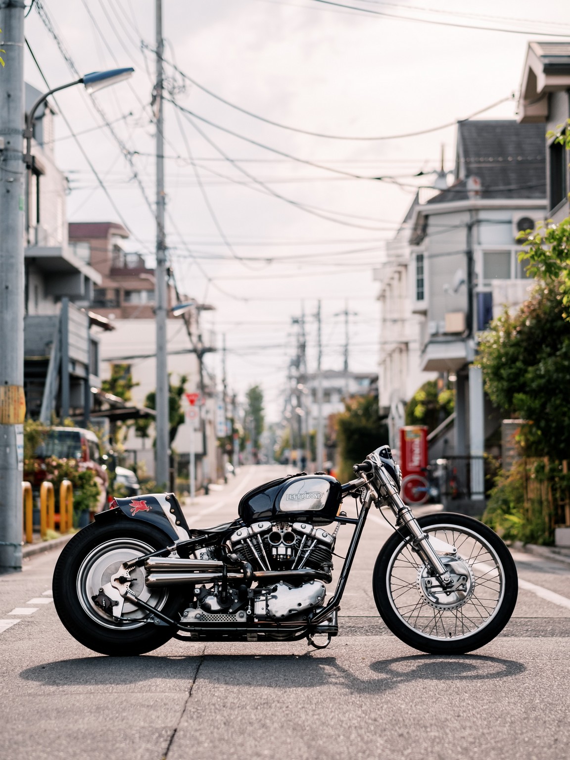 Harley Knucklehead custom bobber in a street in Japan