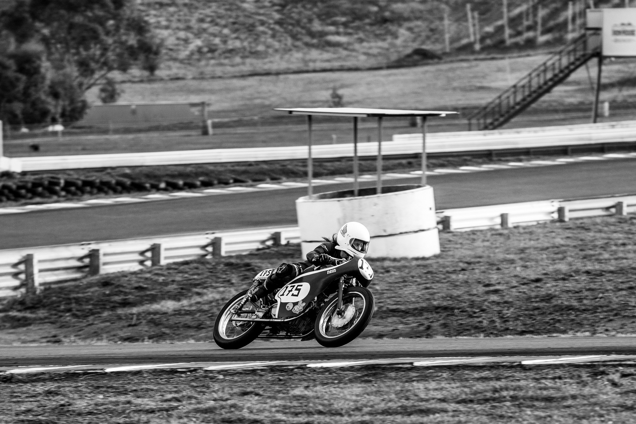 Black and white photo of a racing motorcycle at Tasmania's Baskerville Racetrack