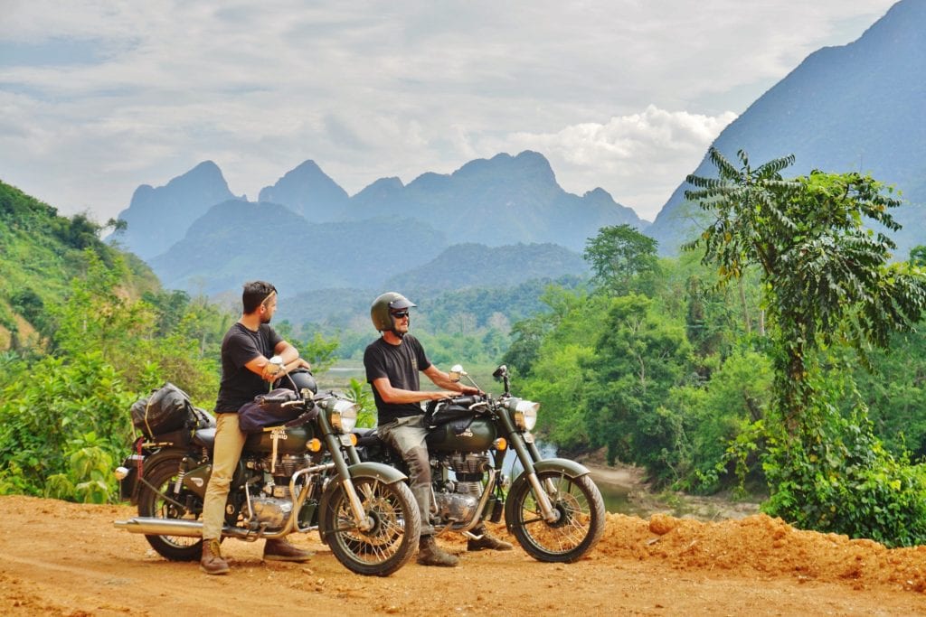 Two riders enjoy the view of Laos