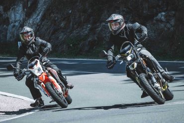 An image of two riders on the SWM 125s