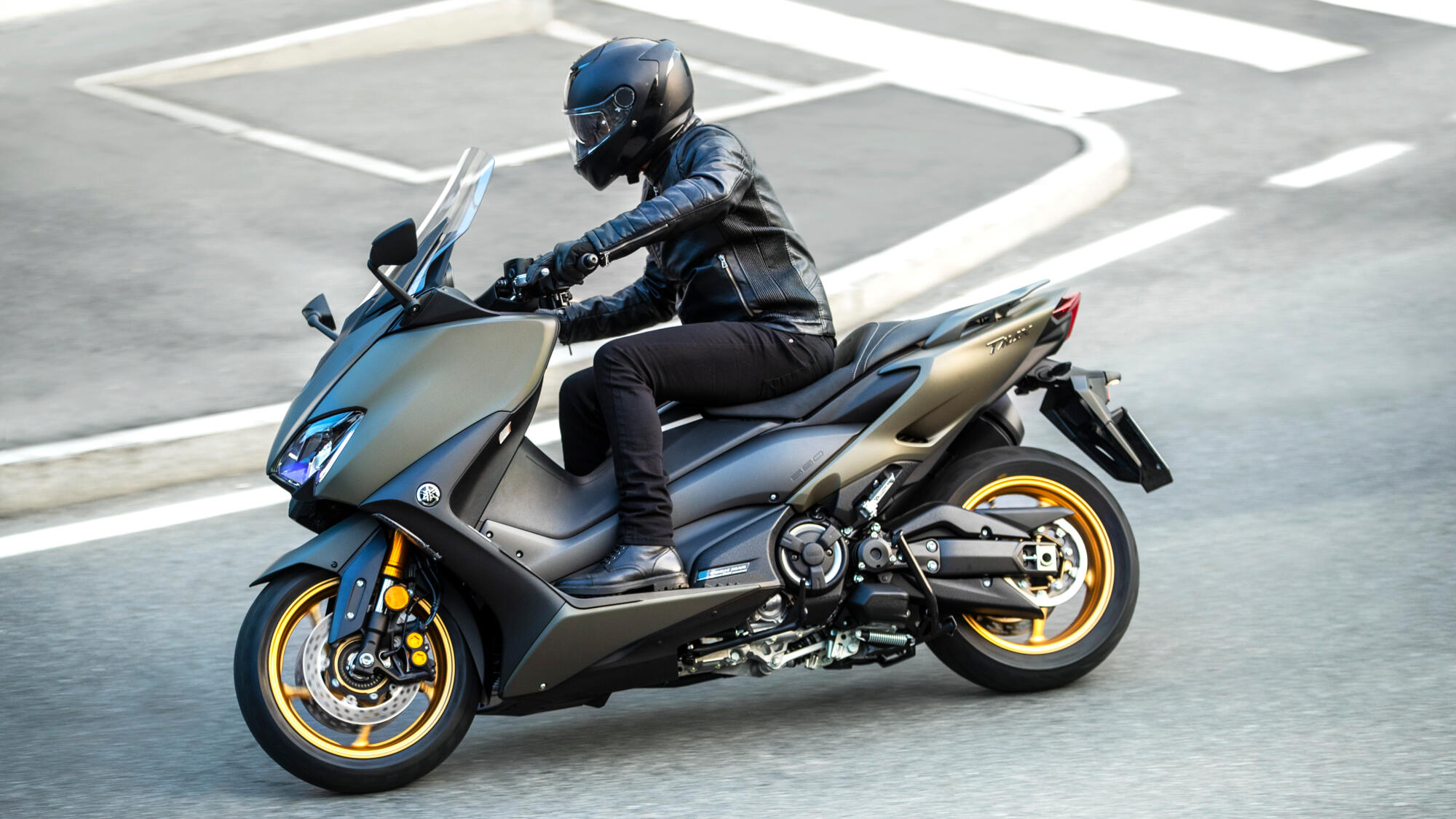 A rider on the Yamaha TMAX taking a corner