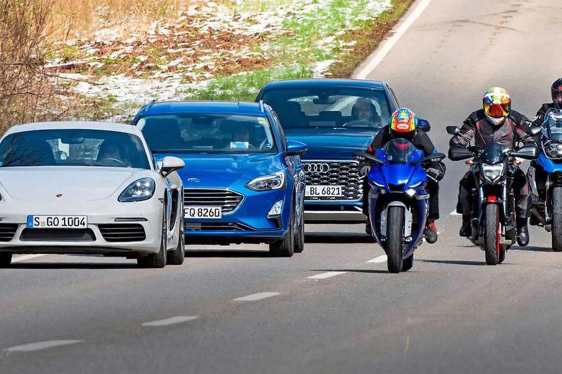 A view of cars driving next to motorcycles. Media courtesy of RideApart.