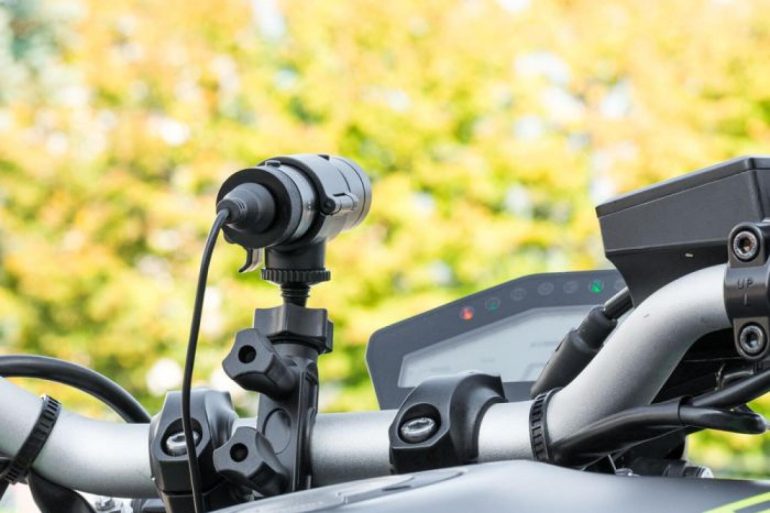 An image of a dash cam mounted on the tank of a Yamaha MT-09.